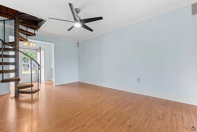 202 Kimberly Rd, Warner Robins, GA 31093 - unfurnished living room with wood finished floors, stairway, baseboards, crown molding, and a ceiling fan