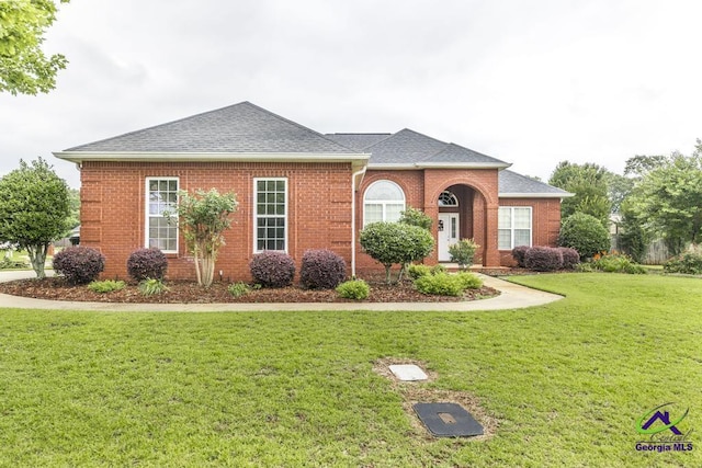 201 Loudon Hill Dr, Warner Robins, GA 31088 - view of front of house with a front lawn, roof with shingles, and brick siding