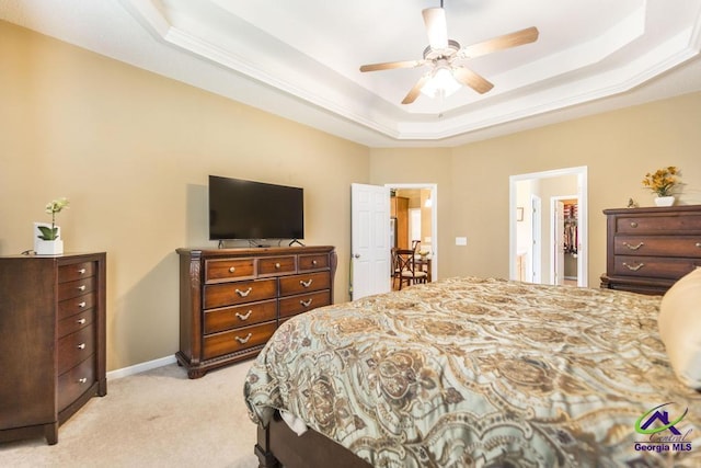 201 Loudon Hill Dr, Warner Robins, GA 31088 - bedroom with a tray ceiling, light carpet, ceiling fan, and baseboards