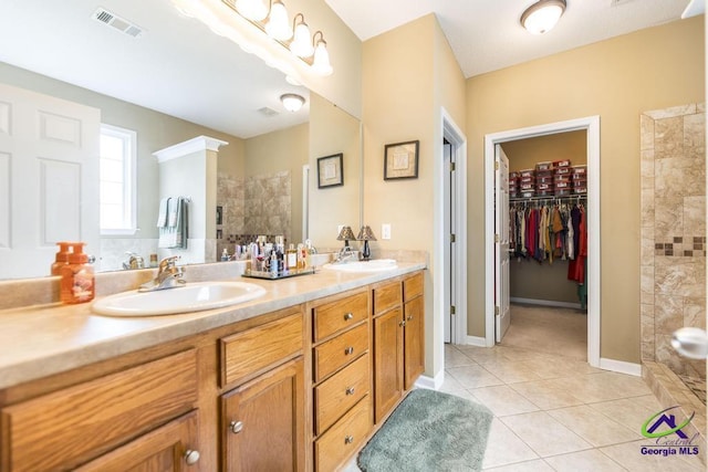 201 Loudon Hill Dr, Warner Robins, GA 31088 - full bath with double vanity, walk in shower, tile patterned floors, and a walk in closet