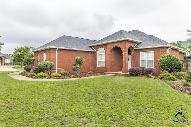201 Loudon Hill Dr, Warner Robins, GA 31088 - view of front of property with brick siding, a front lawn, and roof with shingles
