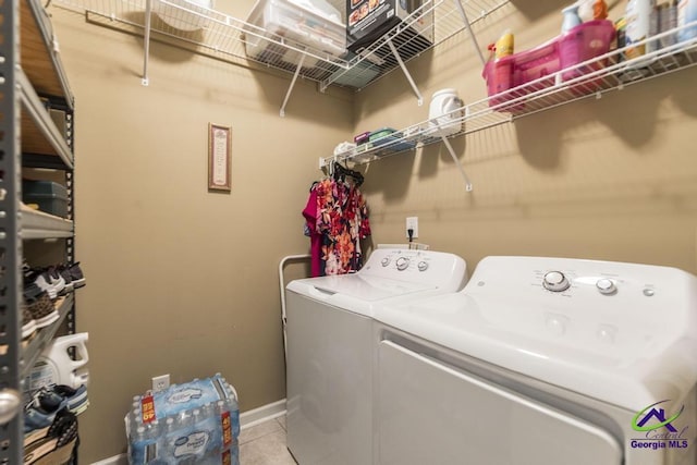 201 Loudon Hill Dr, Warner Robins, GA 31088 - washroom with separate washer and dryer, light tile patterned floors, and baseboards