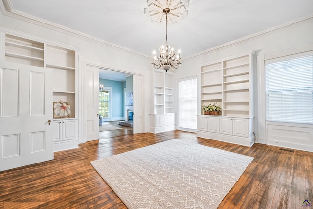 938 Park Pl, Macon, GA 31201 - unfurnished dining area featuring a chandelier, crown molding, built in features, dark wood-style flooring, and baseboards