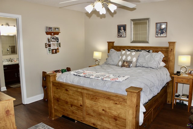 303 Shane, Perry, GA 31069 - bedroom with wood finished floors, baseboards, ceiling fan, ensuite bath, and a sink