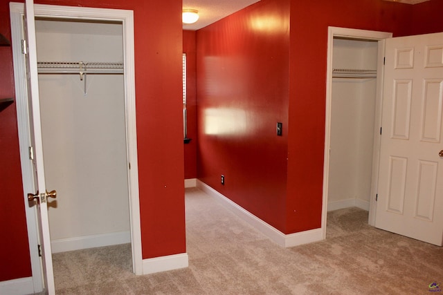 303 Shane, Perry, GA 31069 - unfurnished bedroom with carpet floors, a closet, and baseboards