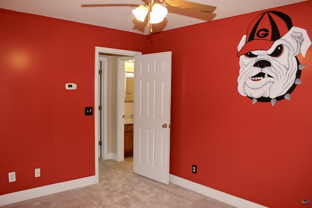 303 Shane, Perry, GA 31069 - unfurnished bedroom featuring light carpet, a ceiling fan, and baseboards