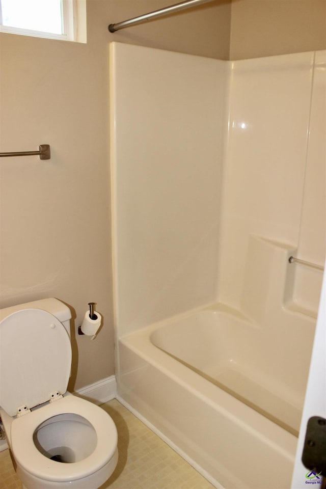 303 Shane, Perry, GA 31069 - full bath featuring tub / shower combination, toilet, and baseboards