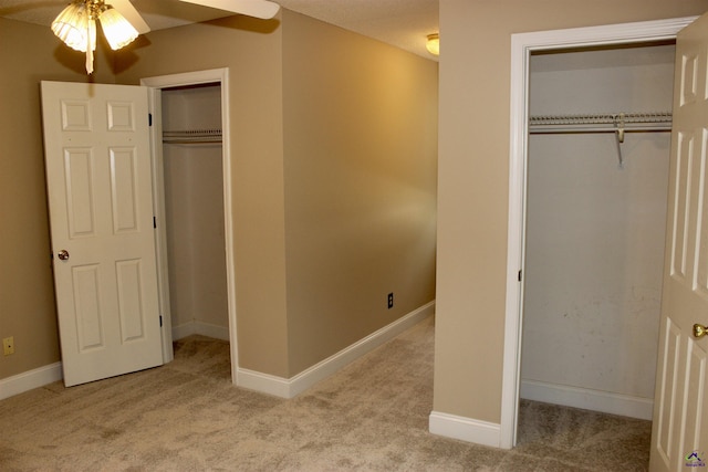 303 Shane, Perry, GA 31069 - unfurnished bedroom featuring carpet flooring, baseboards, and ceiling fan