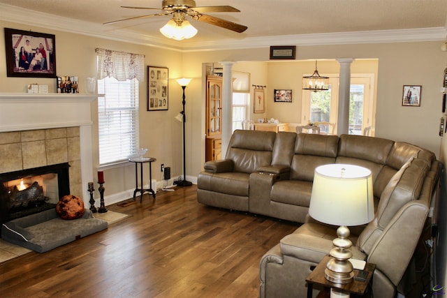 303 Shane, Perry, GA 31069 - living room featuring ornate columns, a ceiling fan, ornamental molding, and dark wood-type flooring