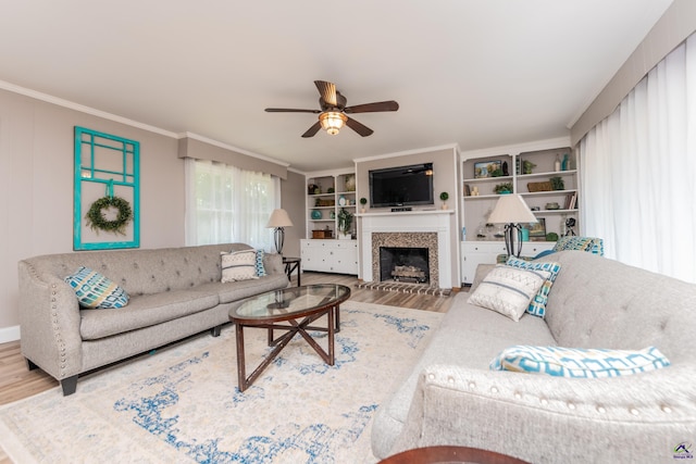 826 Edward Pl, Macon, GA 31204 - living room with wood finished floors, a ceiling fan, a fireplace, and ornamental molding
