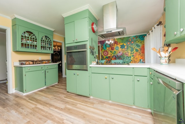 826 Edward Pl, Macon, GA 31204 - kitchen featuring stainless steel oven, island range hood, dishwasher, crown molding, and light wood-style flooring