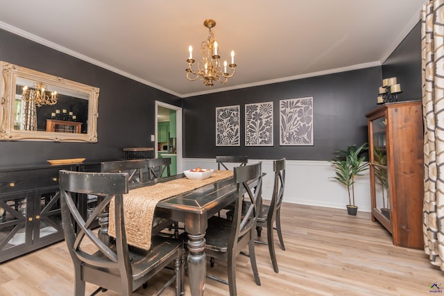 826 Edward Pl, Macon, GA 31204 - dining area with a chandelier, wood finished floors, ornamental molding, and wainscoting