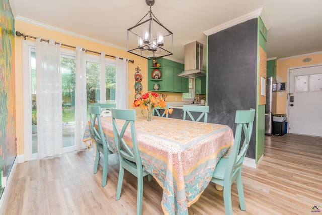 826 Edward Pl, Macon, GA 31204 - dining space featuring a chandelier, ornamental molding, and light wood finished floors