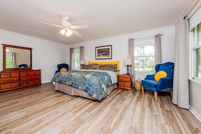 826 Edward Pl, Macon, GA 31204 - bedroom with light wood-style flooring, multiple windows, crown molding, ceiling fan, and baseboards