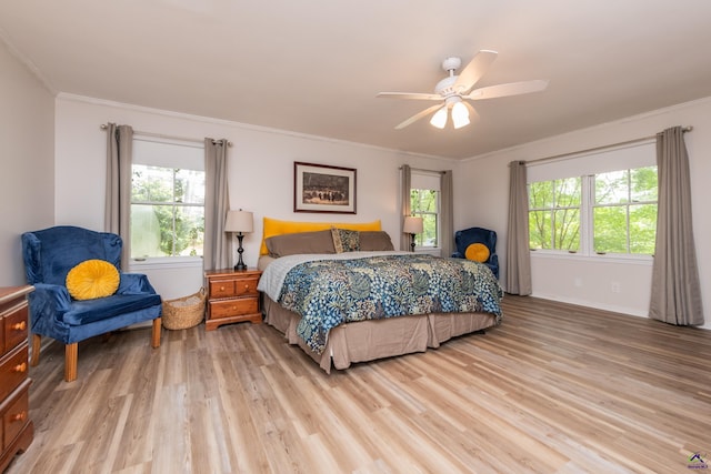 826 Edward Pl, Macon, GA 31204 - bedroom with light wood-type flooring, multiple windows, ornamental molding, ceiling fan, and baseboards