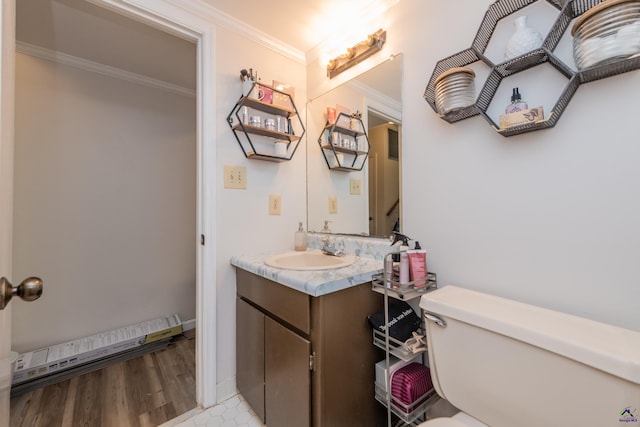 826 Edward Pl, Macon, GA 31204 - half bathroom with crown molding, vanity, toilet, and wood finished floors