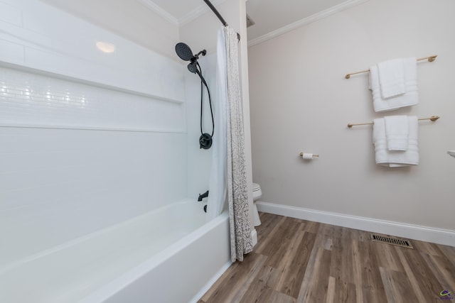 826 Edward Pl, Macon, GA 31204 - bathroom with ornamental molding, wood finished floors, toilet, baseboards, and shower / bath combo