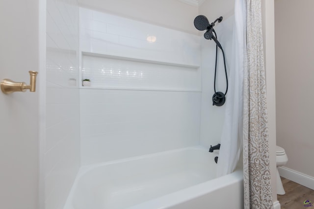 826 Edward Pl, Macon, GA 31204 - bathroom with toilet, shower / tub combo, and wood finished floors