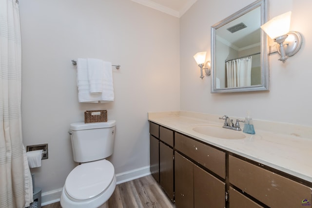 826 Edward Pl, Macon, GA 31204 - full bath with crown molding, vanity, toilet, wood finished floors, and baseboards