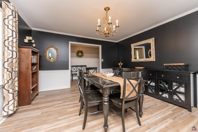 826 Edward Pl, Macon, GA 31204 - dining room featuring a chandelier, wood finished floors, ornamental molding, and a wainscoted wall