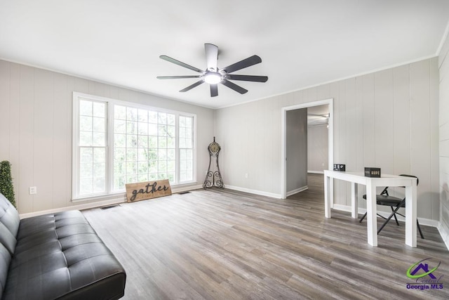 123 Robinhood Dr, Warner Robins, GA 31088 - living room with wood finished floors, ceiling fan, baseboards, and crown molding