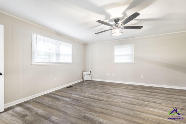 123 Robinhood Dr, Warner Robins, GA 31088 - spare room featuring crown molding, wood finished floors, a ceiling fan, and baseboards