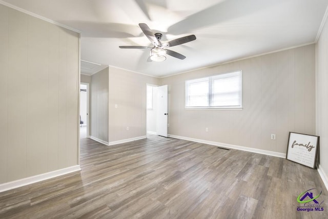123 Robinhood Dr, Warner Robins, GA 31088 - unfurnished room featuring wood finished floors, ceiling fan, ornamental molding, and baseboards