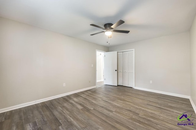 123 Robinhood Dr, Warner Robins, GA 31088 - unfurnished bedroom with baseboards, wood finished floors, a closet, and ceiling fan