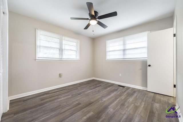 123 Robinhood Dr, Warner Robins, GA 31088 - unfurnished bedroom with wood finished floors, baseboards, and ceiling fan