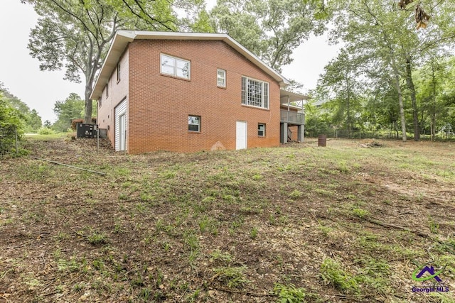 123 Robinhood Dr, Warner Robins, GA 31088 - view of home's exterior with central AC unit and brick siding