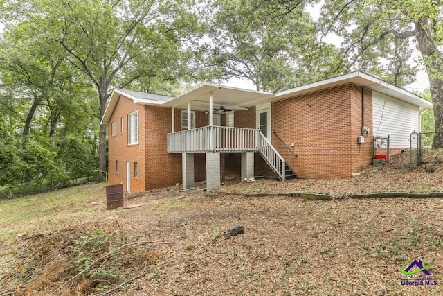 123 Robinhood Dr, Warner Robins, GA 31088 - view of front facade featuring ceiling fan, brick siding, and stairs