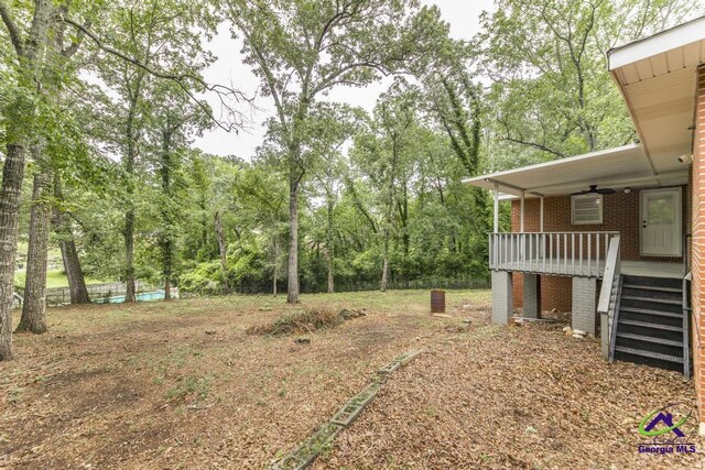 123 Robinhood Dr, Warner Robins, GA 31088 - view of yard featuring ceiling fan, stairway, and a porch