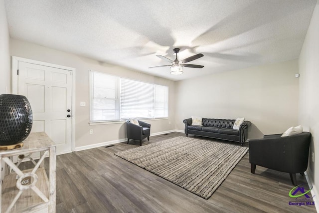123 Robinhood Dr, Warner Robins, GA 31088 - living room with a ceiling fan, wood finished floors, baseboards, and a textured ceiling