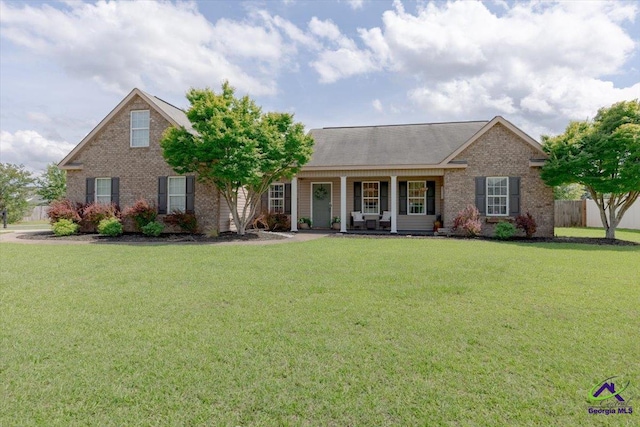 133 Gage Dr, Perry, GA 31069 - view of front facade with brick siding and a porch