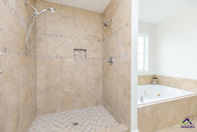133 Gage Dr, Perry, GA 31069 - bathroom featuring a tile shower and a tub with jets