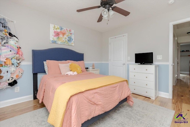 133 Gage Dr, Perry, GA 31069 - bedroom featuring wood finished floors, ceiling fan, and baseboards