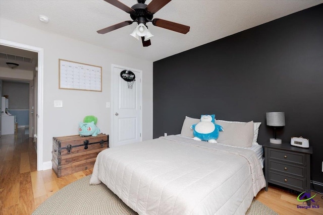 133 Gage Dr, Perry, GA 31069 - bedroom with light wood-style flooring, ceiling fan, and baseboards