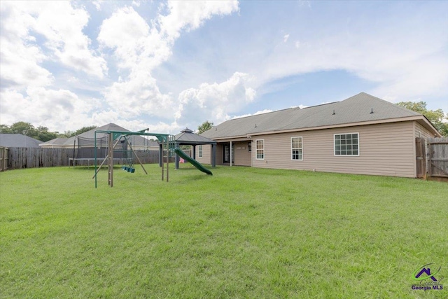 133 Gage Dr, Perry, GA 31069 - rear view of property featuring a playground