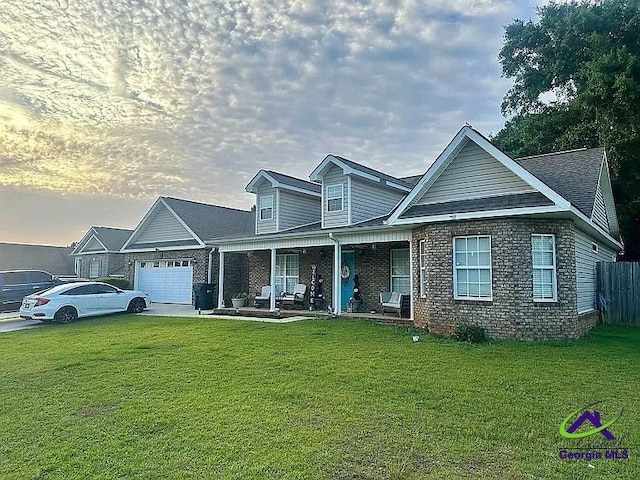 108 Christine, Perry, GA 31069 - view of front of home featuring a garage, covered porch, and brick siding