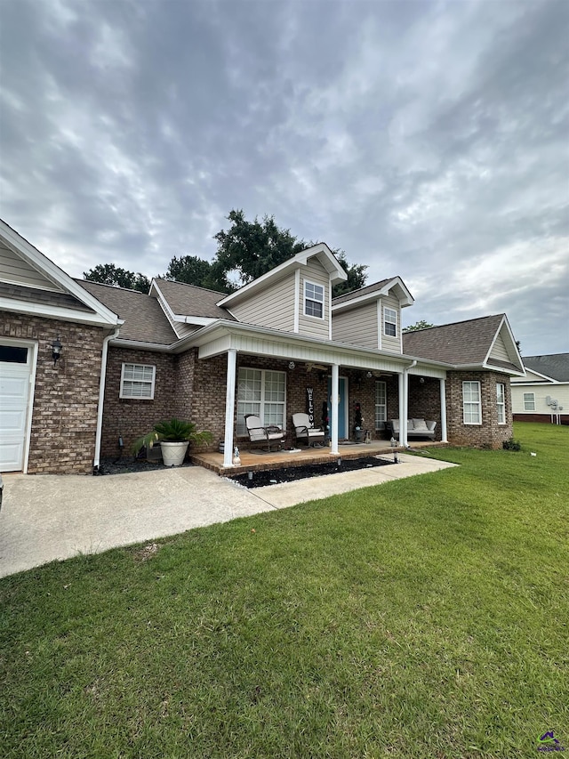 108 Christine, Perry, GA 31069 - rear view of property with brick siding, a yard, a porch, and a shingled roof