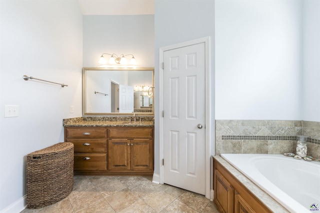307 George Francis Ct, Bonaire, GA 31005 - full bath with vanity, a garden tub, and baseboards