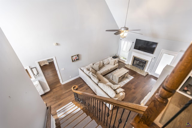307 George Francis Ct, Bonaire, GA 31005 - living room featuring high vaulted ceiling, wood finished floors, ceiling fan, baseboards, and a fireplace