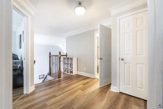 307 George Francis Ct, Bonaire, GA 31005 - hall featuring an upstairs landing, ornamental molding, wood finished floors, and baseboards