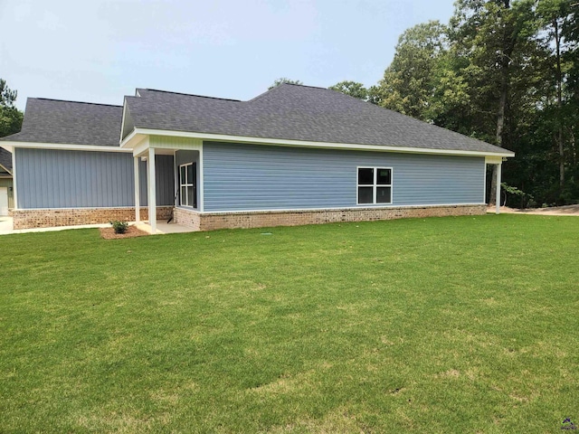 109 Silver Maple Ct, Byron, GA 31008 - view of side of home with a yard, a shingled roof, and brick siding