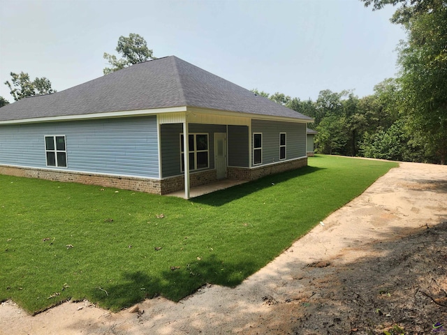 109 Silver Maple Ct, Byron, GA 31008 - view of home's exterior featuring a lawn, a shingled roof, and brick siding