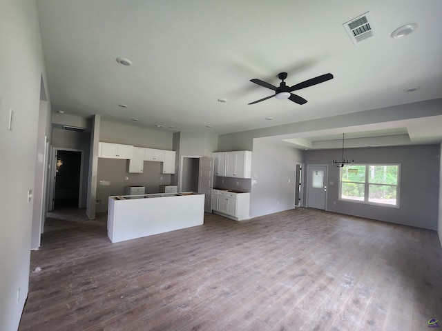 109 Silver Maple Ct, Byron, GA 31008 - unfurnished living room featuring ceiling fan, wood finished floors, and a chandelier