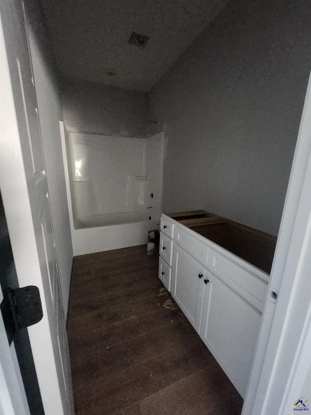 109 Silver Maple Ct, Byron, GA 31008 - bathroom with wood finished floors, vanity, and bathtub / shower combination