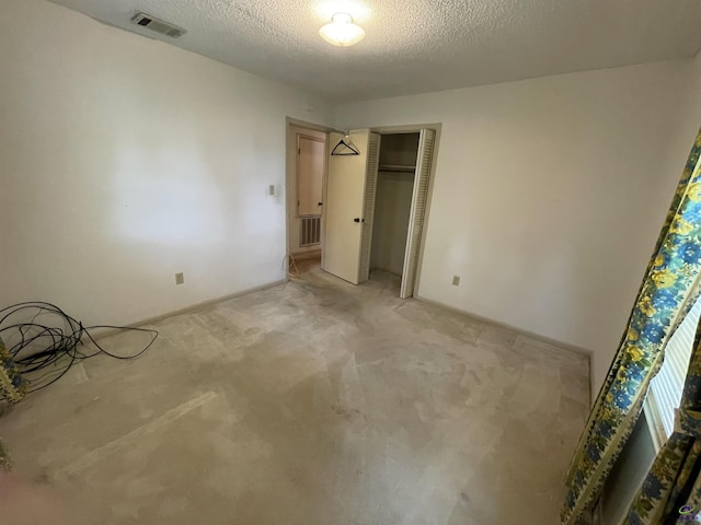 122 Cheryl Blvd, Warner Robins, GA 31088 - unfurnished bedroom with light carpet, a textured ceiling, and a closet