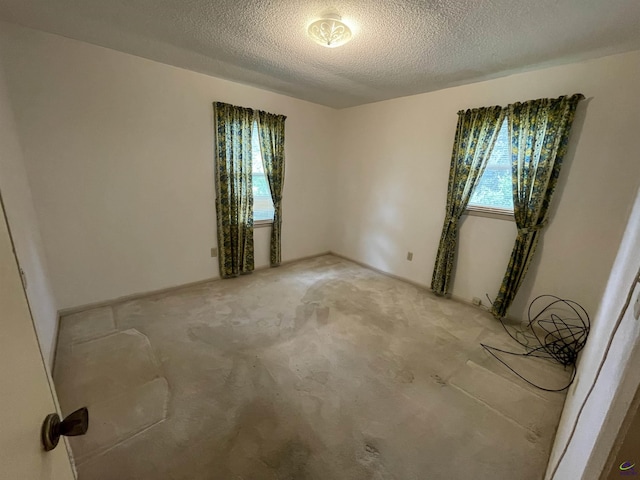122 Cheryl Blvd, Warner Robins, GA 31088 - unfurnished room with a textured ceiling and light carpet