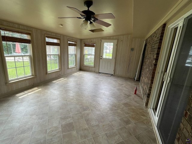 122 Cheryl Blvd, Warner Robins, GA 31088 - unfurnished sunroom featuring wood walls and brick wall